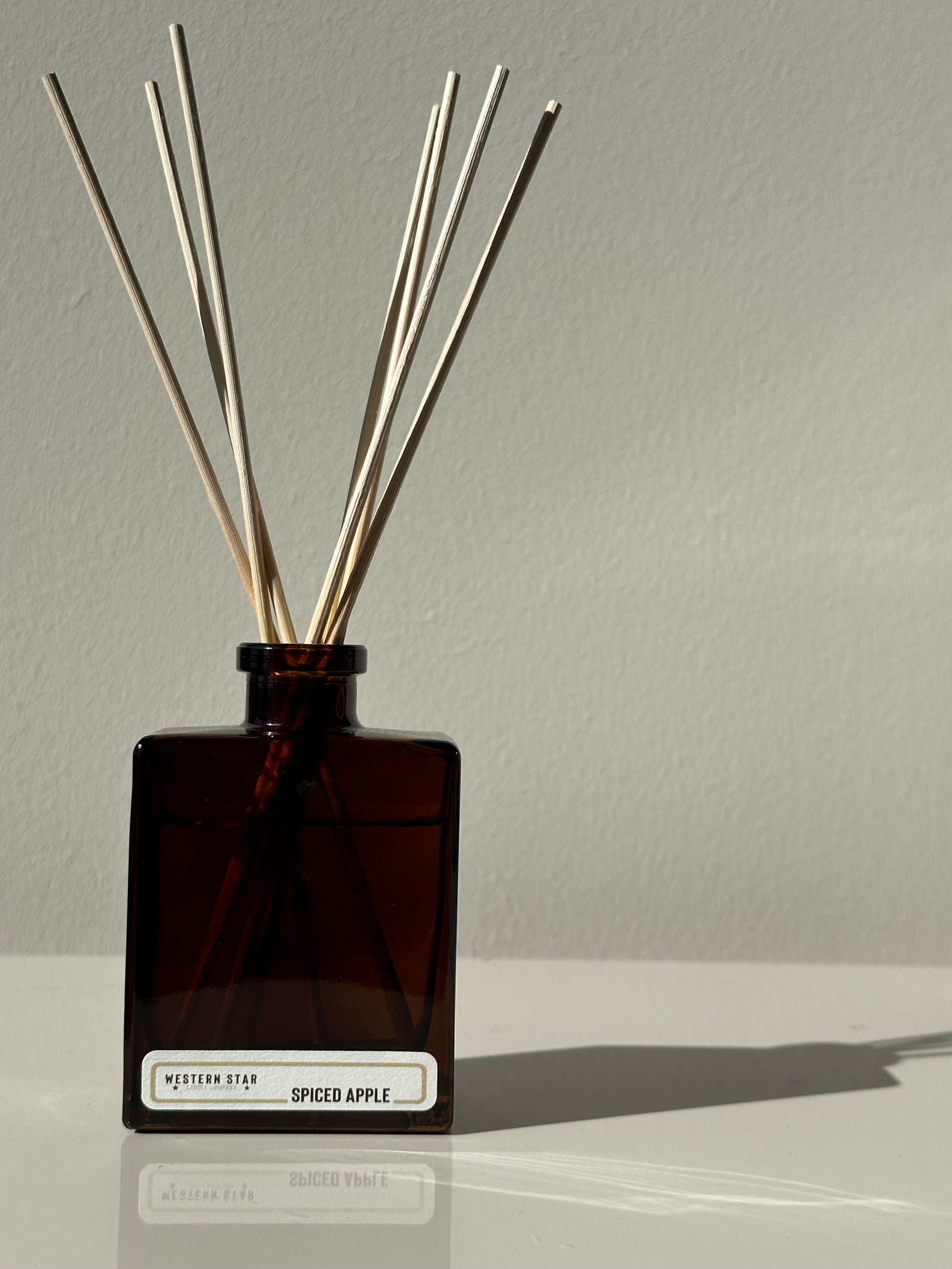 Spiced apple scented reed diffuser, amber bottle